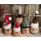 Here is a group of handmade Christmas gourds. Each elf has a custom hat and a cute elf facial expression carved out of their gourd shell.